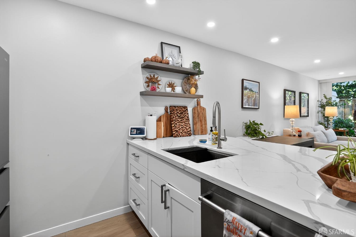 222 Laurel Street, Unit 109 San Carlos, CA 94070 - Photo 9 of 27 a kitchen with a sink a stove and cabinets