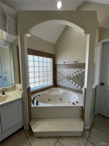 a bathroom with a bathtub and a sink