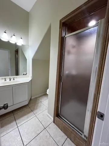 a bathroom with a mirror sink and vanity
