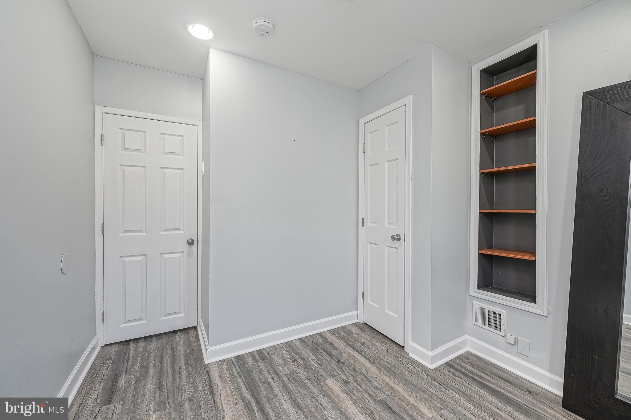 1920 Fitzgerald Street Philadelphia, PA 19145 - Photo 16 of 25 a view of empty room with wooden floor and closet