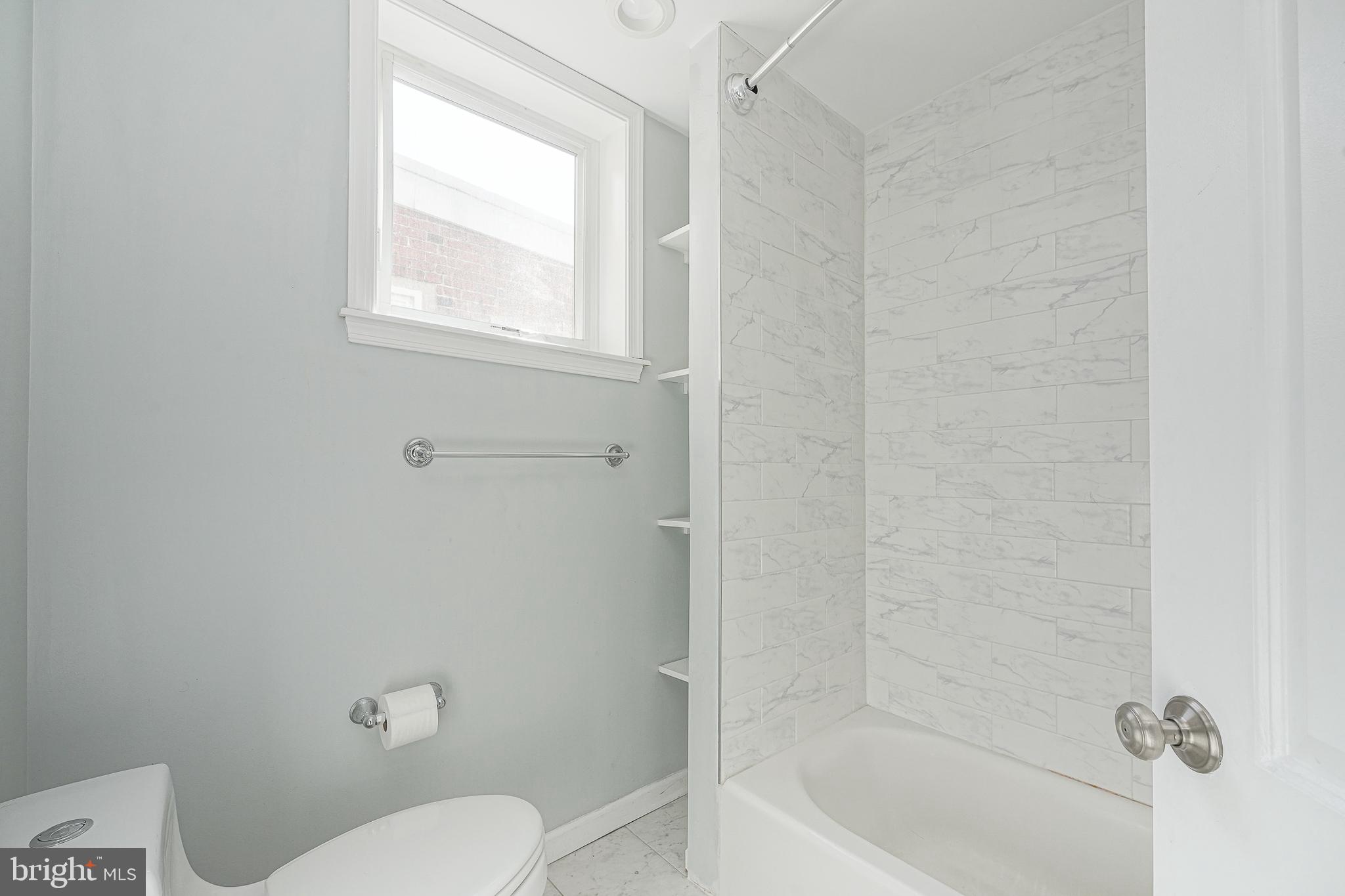 1920 Fitzgerald Street Philadelphia, PA 19145 - Photo 17 of 25 a bathroom with a toilet and bathtub