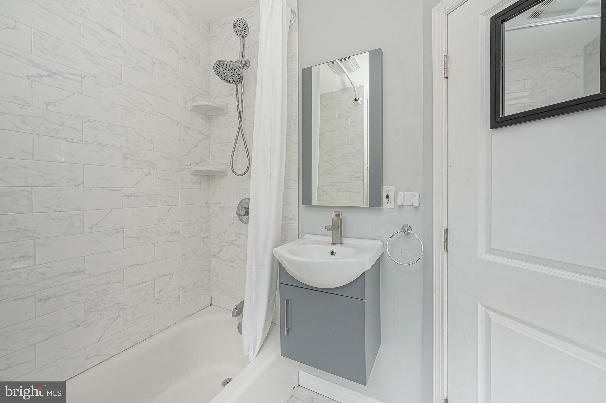 1920 Fitzgerald Street Philadelphia, PA 19145 - Photo 18 of 25 a bathroom with a sink and a mirror