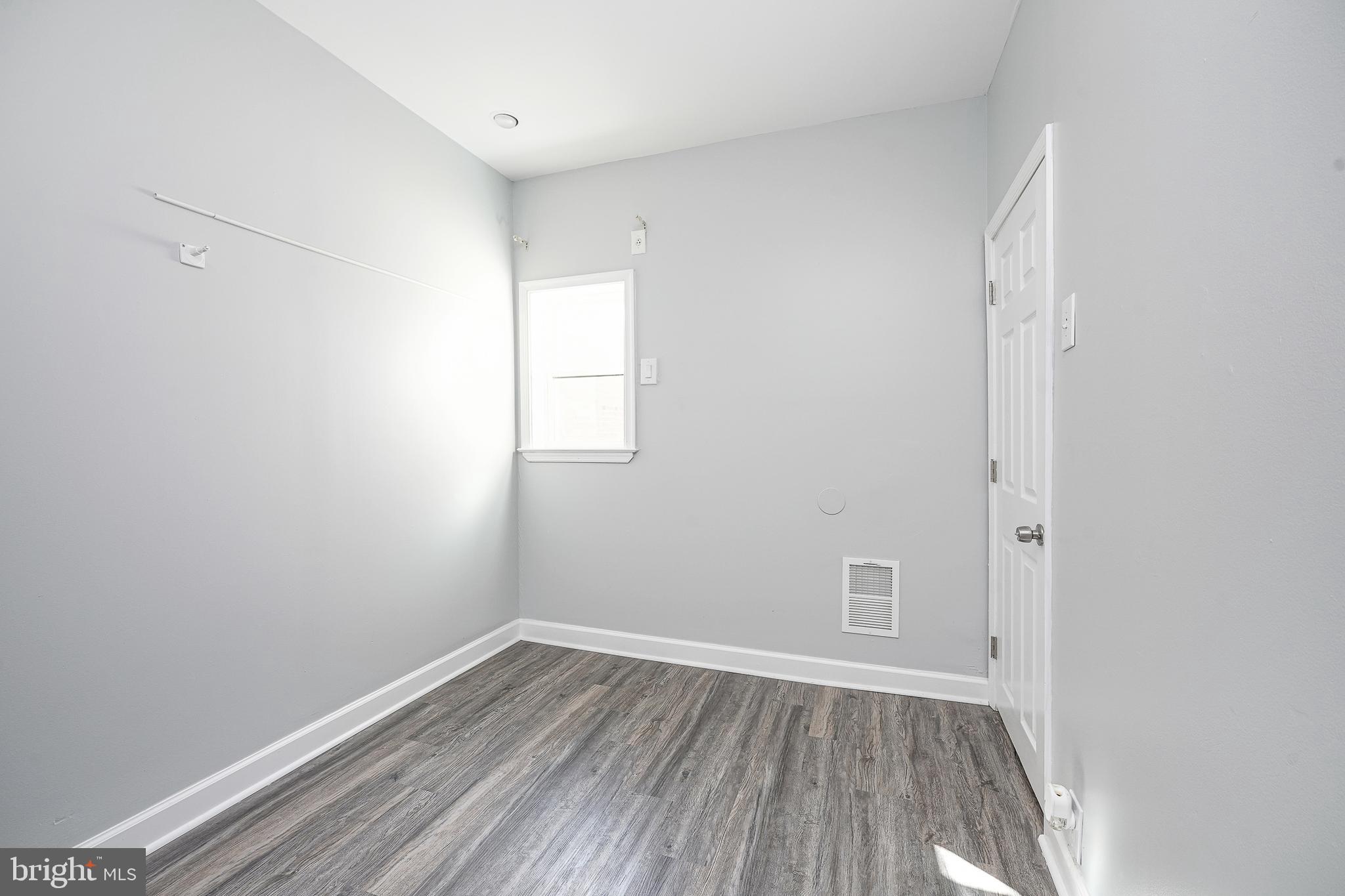 1920 Fitzgerald Street Philadelphia, PA 19145 - Photo 20 of 25 a view of room with window and hardwood floor