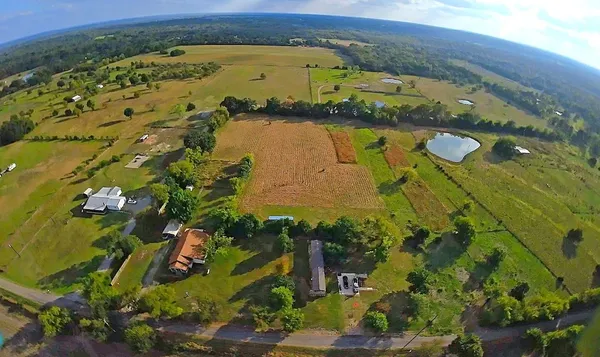 a view of a swimming pool with a yard