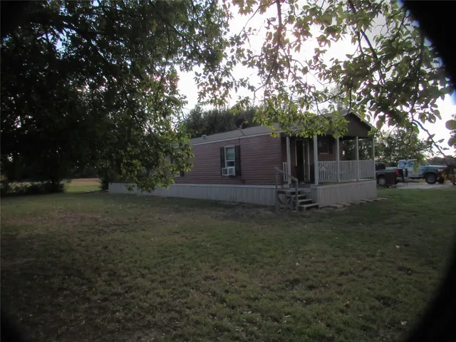 a bathroom with a shower and window