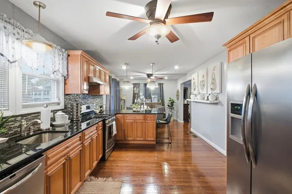 a view of a dining room with furniture window and wooden floor