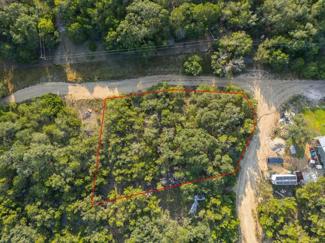 a view of a lake with a house in the background