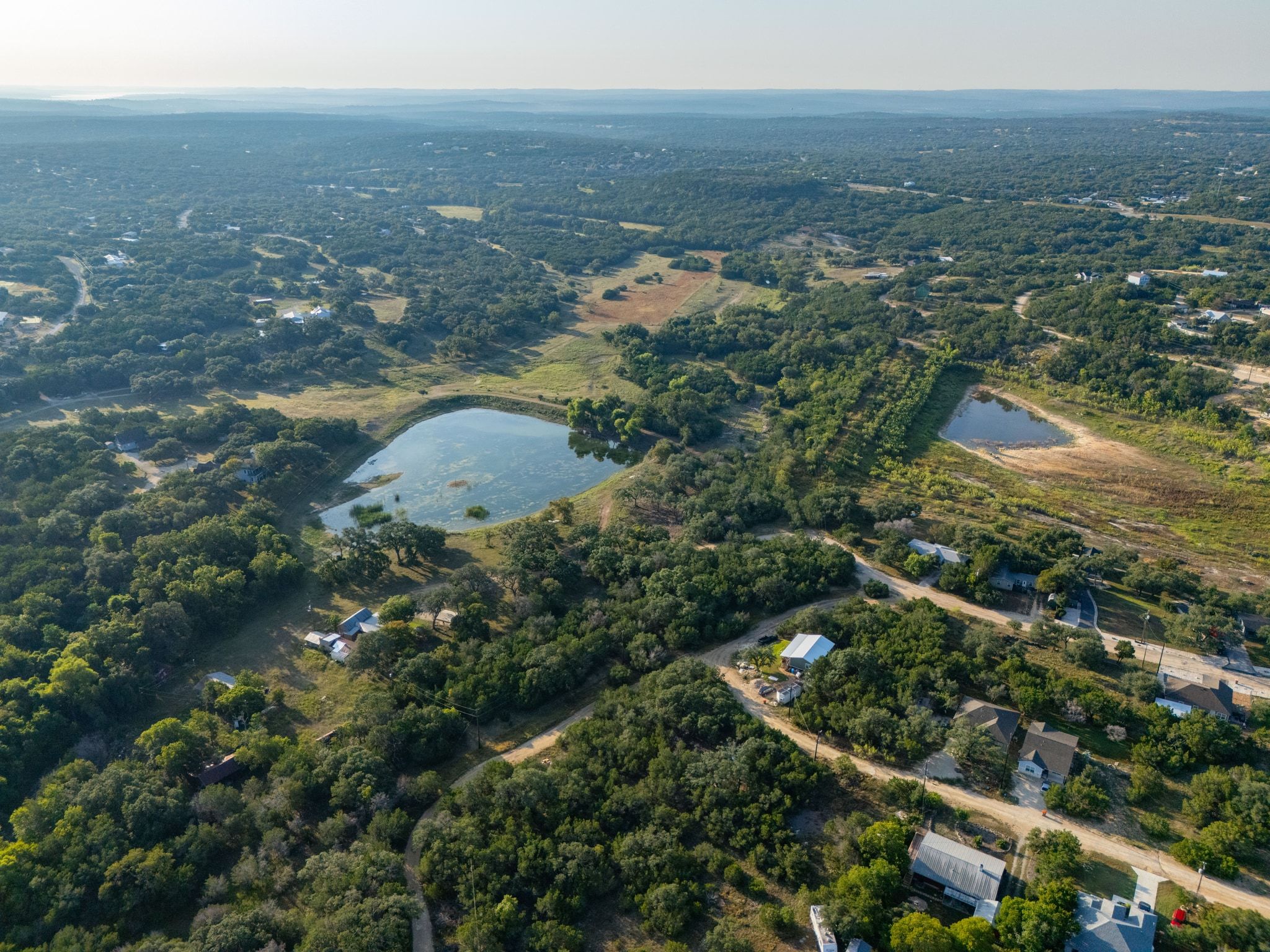 195 Hill Drive Spring Branch, TX 78070 - Photo 3 of 10 an aerial view of residential houses with outdoor space and swimming pool