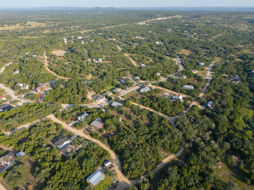 195 Hill Drive Spring Branch, TX 78070 - Photo 5 of 10 an aerial view of residential houses with outdoor space and trees