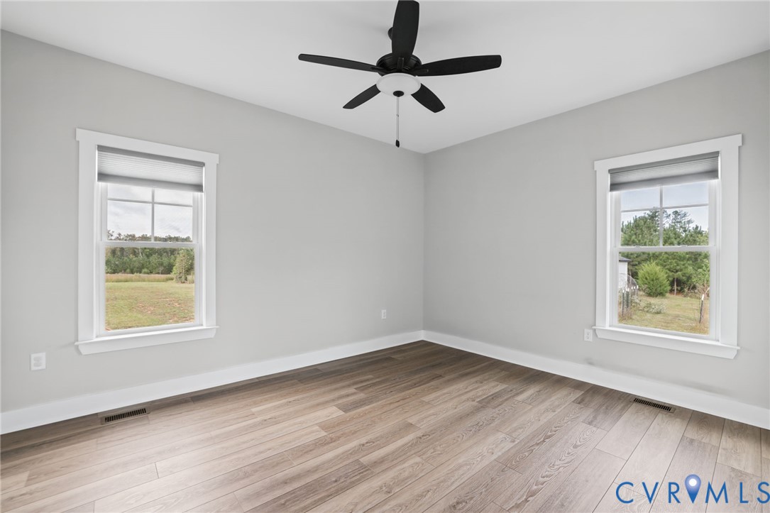 115 Jenkins Church Road Cumberland, VA 23040 - Photo 15 of 28 Bedroom 3, Light gray wall paint, wood-finish floo
