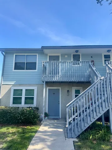 a view of backyard with deck and entertaining space