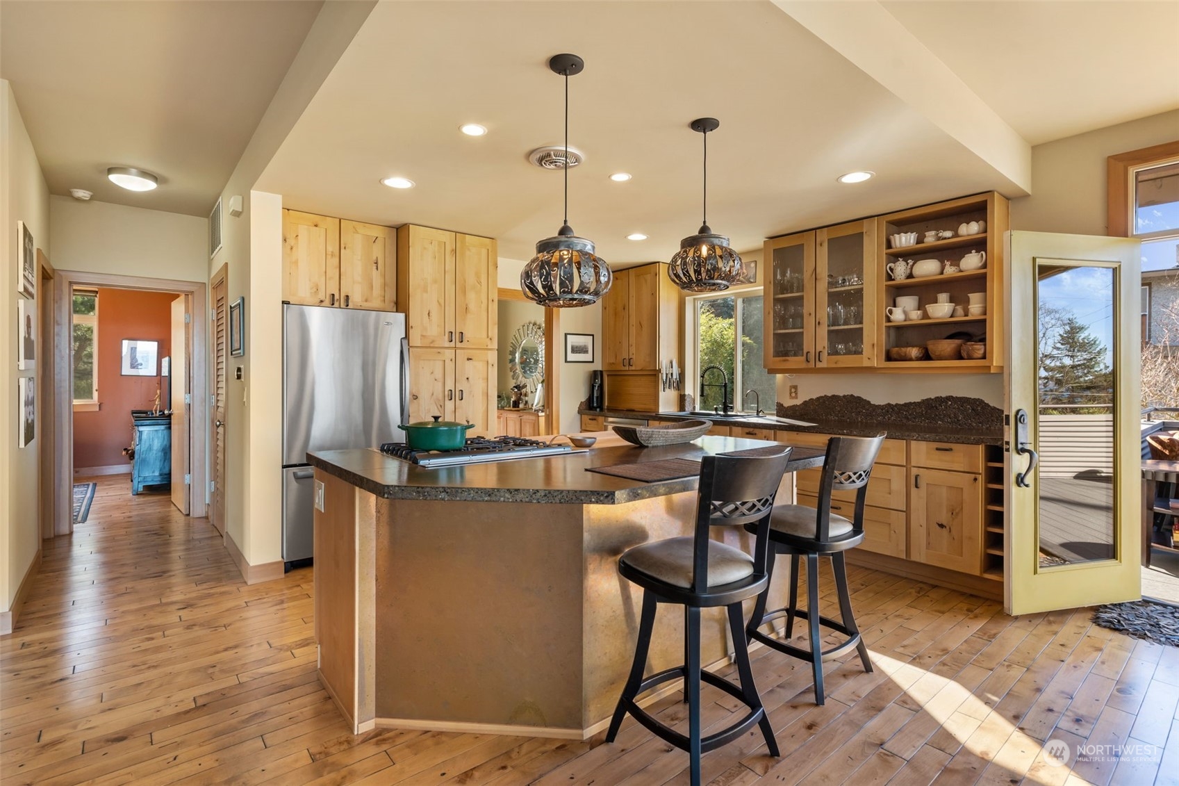 341 South State Street Bellingham, WA 98225 - Photo 14 of 40 a view of a kitchen with dining table and chairs