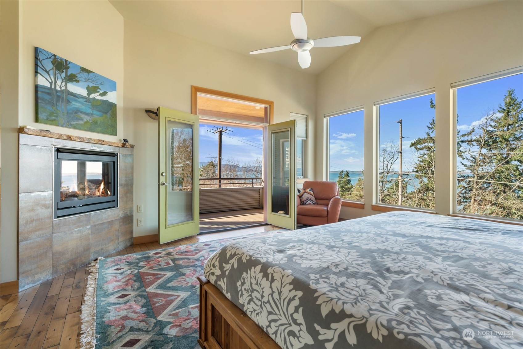 341 South State Street Bellingham, WA 98225 - Photo 16 of 40 a large bedroom with a bed and glass door