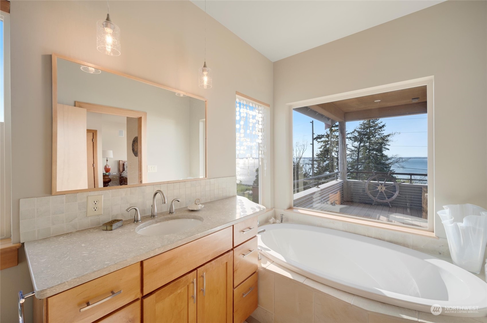 341 South State Street Bellingham, WA 98225 - Photo 21 of 40 a bathroom with a granite countertop sink and a large mirror