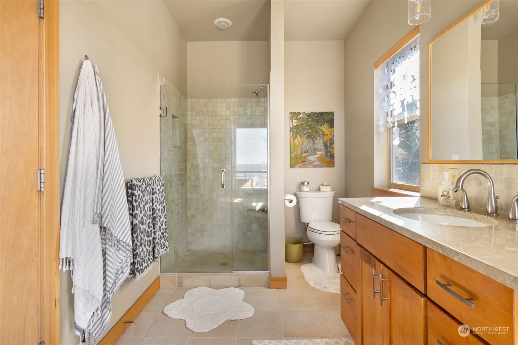 341 South State Street Bellingham, WA 98225 - Photo 22 of 40 a bathroom with a granite countertop sink a toilet and shower