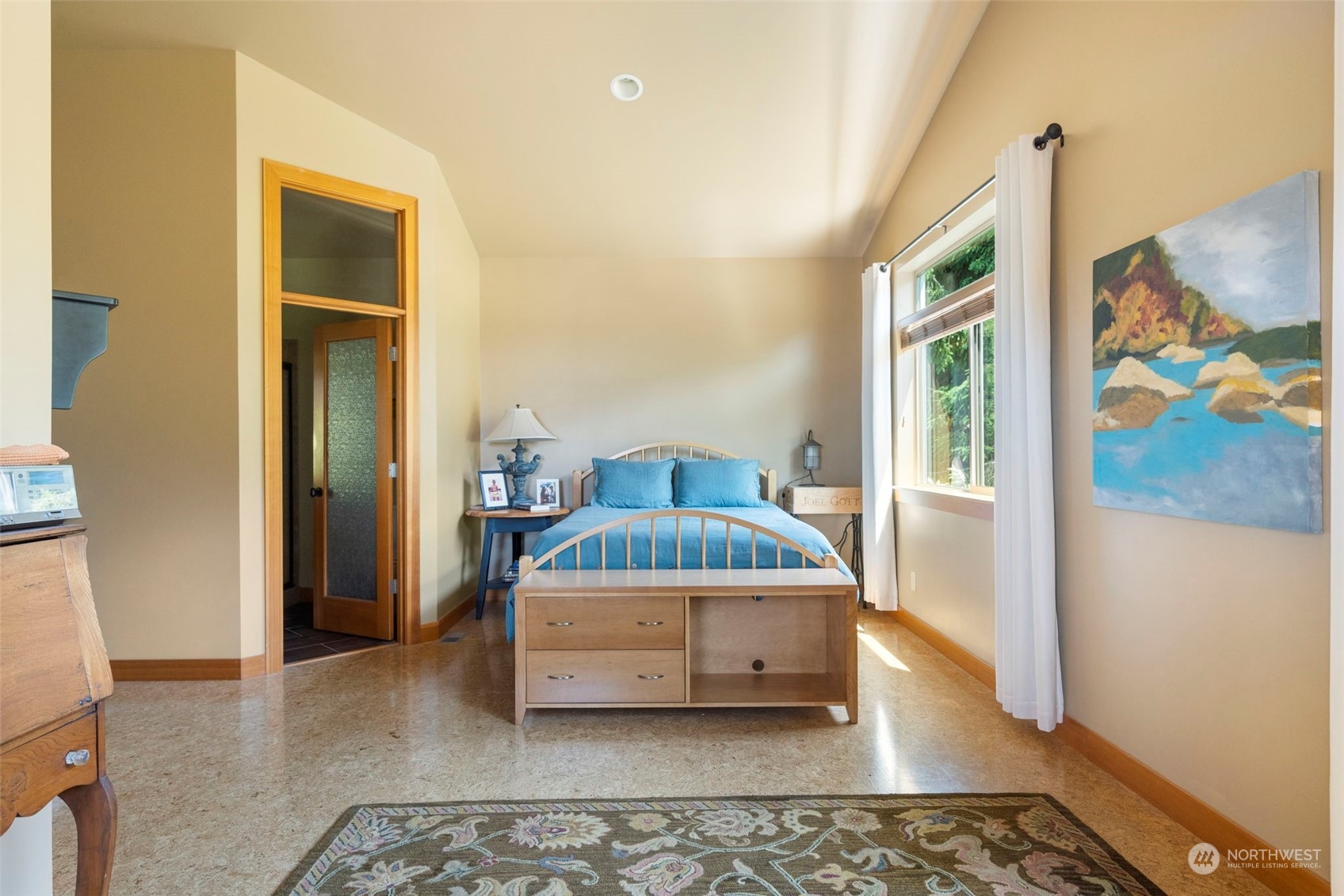 341 South State Street Bellingham, WA 98225 - Photo 24 of 40 a bedroom with a bed and wooden floor