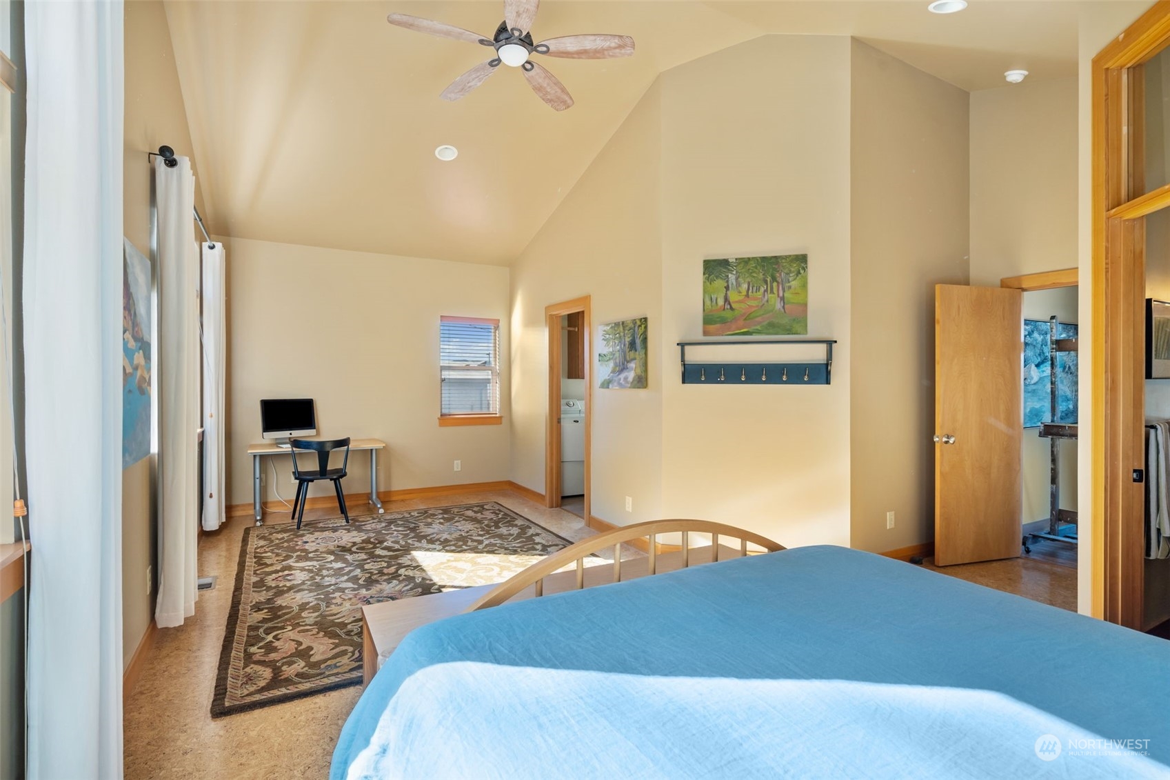 341 South State Street Bellingham, WA 98225 - Photo 26 of 40 a bedroom with a bed and a table in it