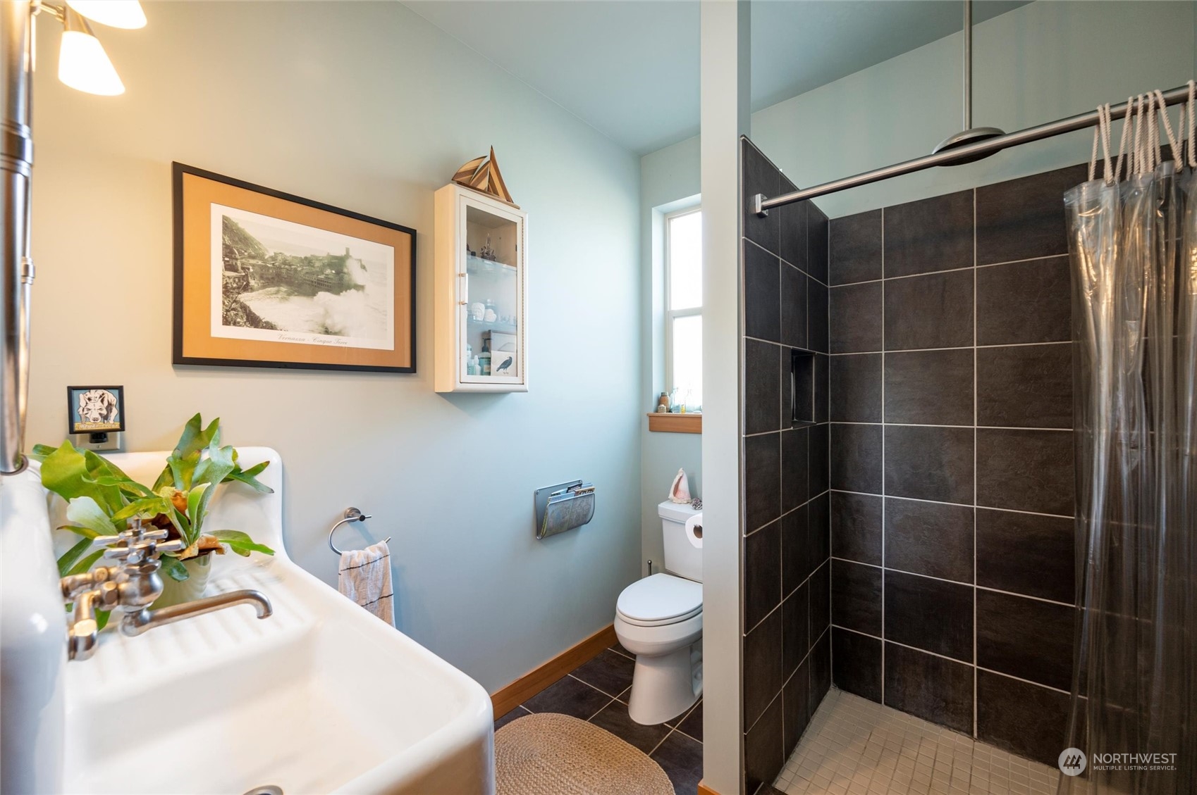 341 South State Street Bellingham, WA 98225 - Photo 28 of 40 a bathroom with a sink mirror vanity and toilet