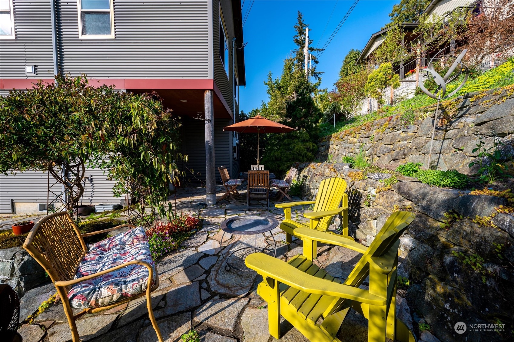 341 South State Street Bellingham, WA 98225 - Photo 33 of 40 a view of a patio with table and chairs and potted plants