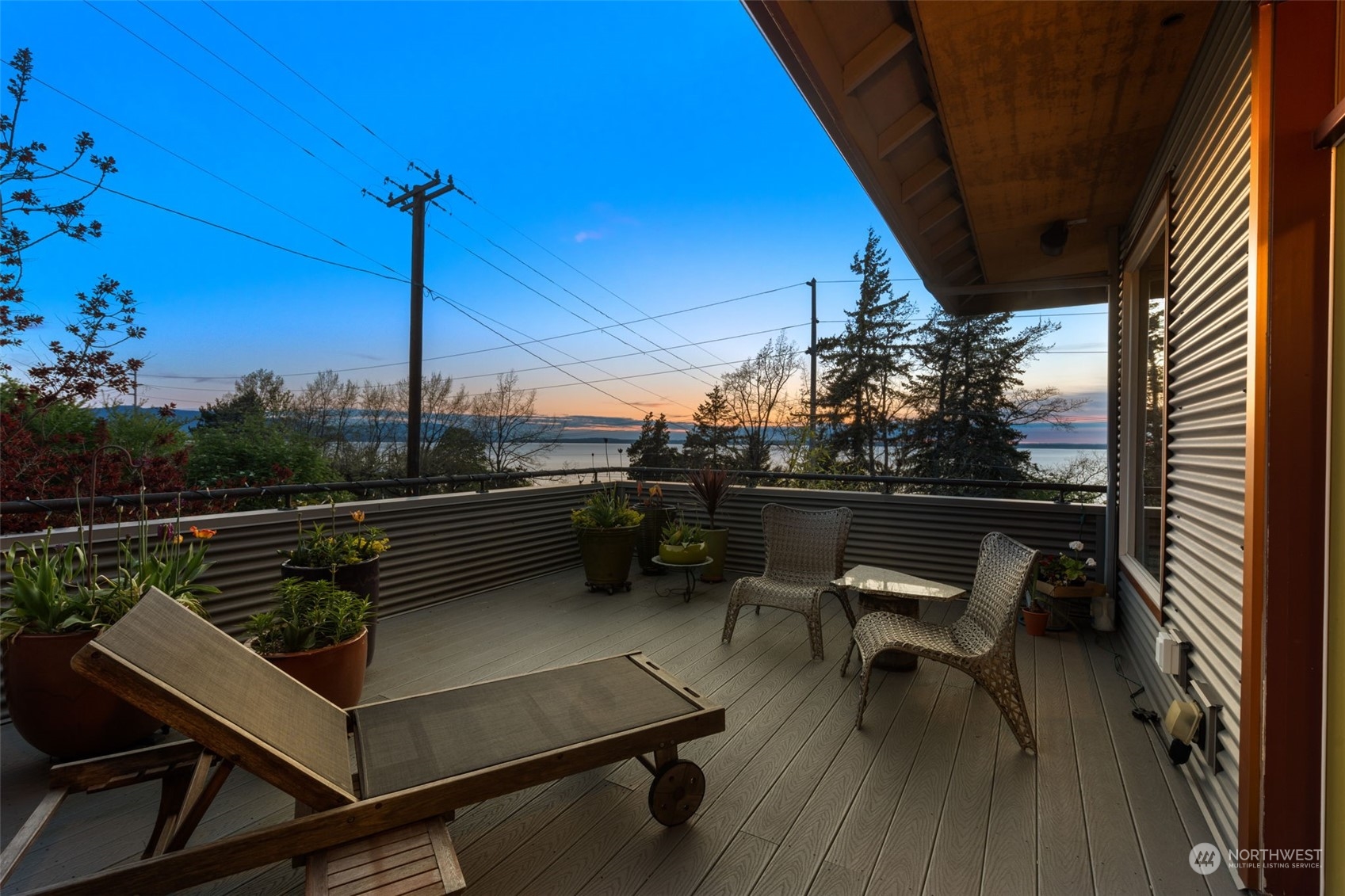 341 South State Street Bellingham, WA 98225 - Photo 5 of 40 a view of a roof deck with couches and wooden floor