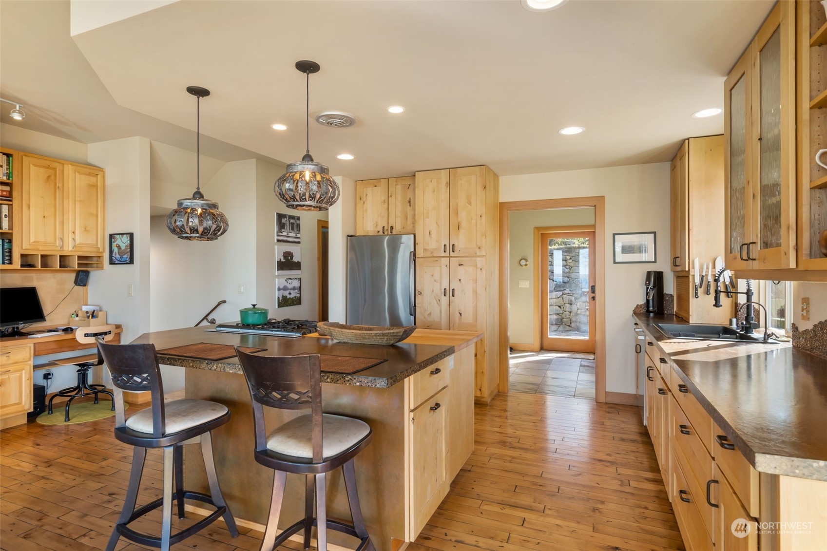 341 South State Street Bellingham, WA 98225 - Photo 10 of 40 a kitchen with granite countertop a sink cabinets and stainless steel appliances