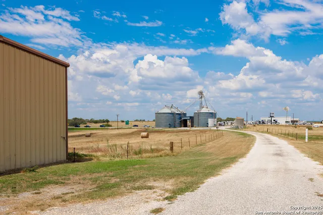 a view of a swimming pool with a yard
