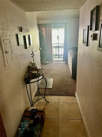 a room with gym equipment and windows