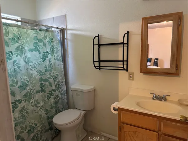 a room with chairs and flat screen tv