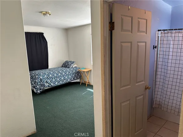 a bathroom with a toilet and shower