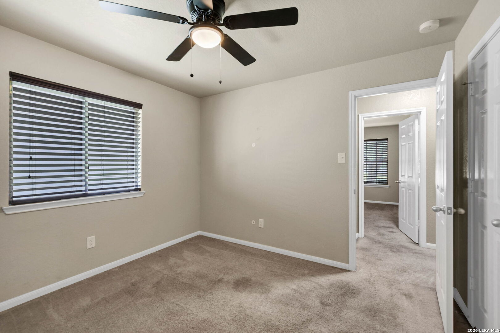 4015 Shervin Way Converse, TX 78109 - Photo 31 of 43 a view of empty room with window and ceiling fan