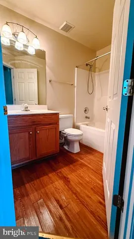 a bathroom with a sink a toilet and a bathtub