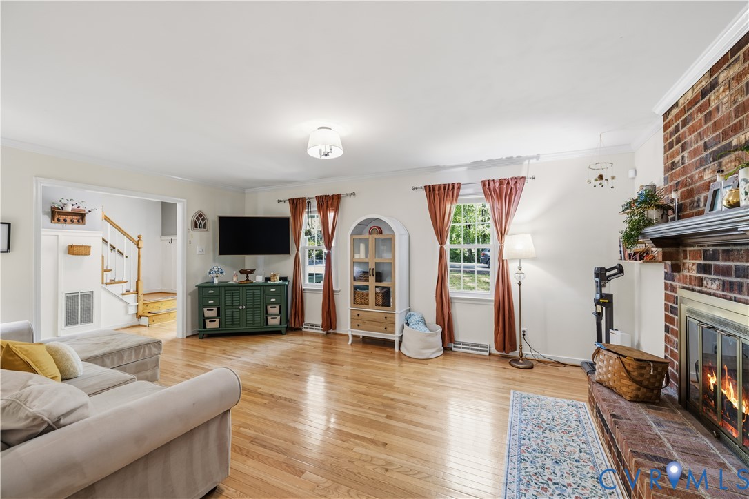 Spacious living area featuring hardwood flooring,