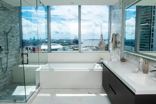 a bathroom with a bathtub and a sink