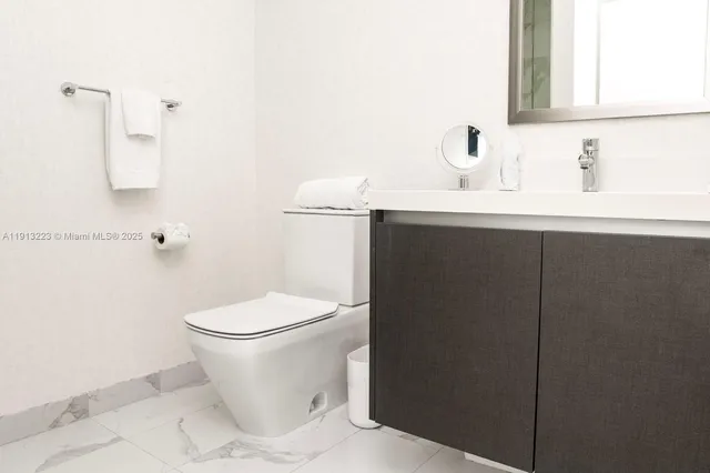 a close view of a sink and a mirror in a bathroom