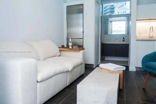 a living room with a bed and furniture