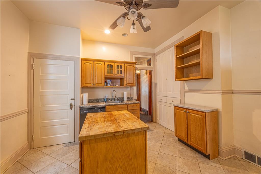 114 Union Street Uniontown, PA 15401 - Photo 9 of 28 a kitchen with a refrigerator and counter space