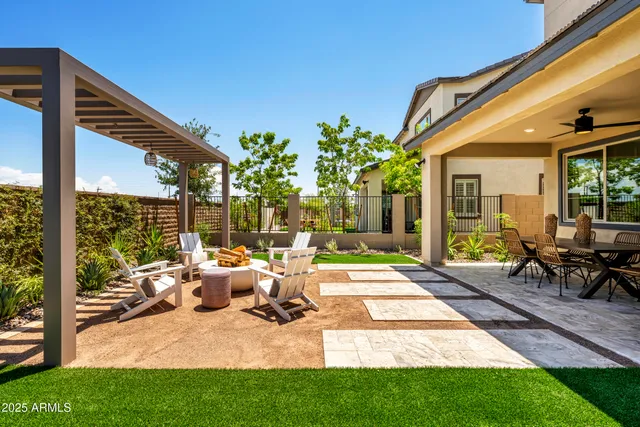 a view of swimming pool with lawn chairs and couches