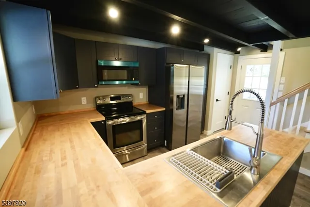 a kitchen with a stove and a refrigerator