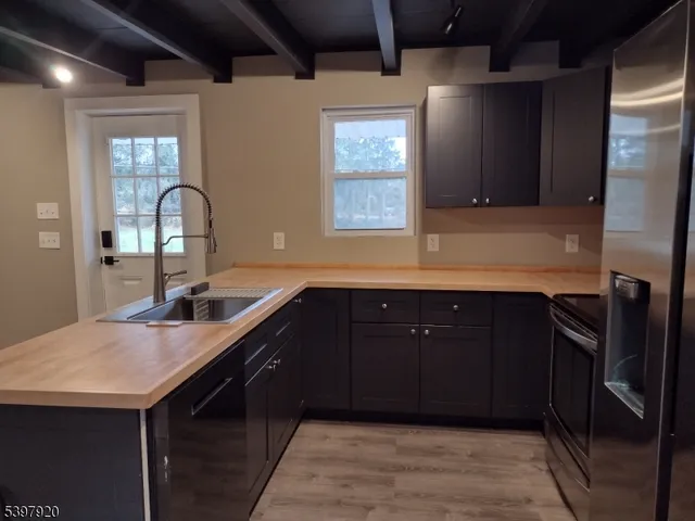 a kitchen with a sink and cabinets