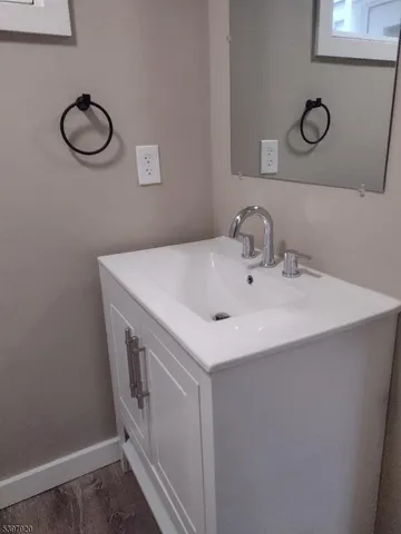 a utility room with sink dryer and washer