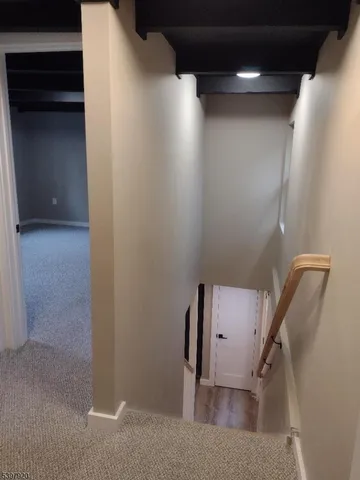 a view of staircase with utility room