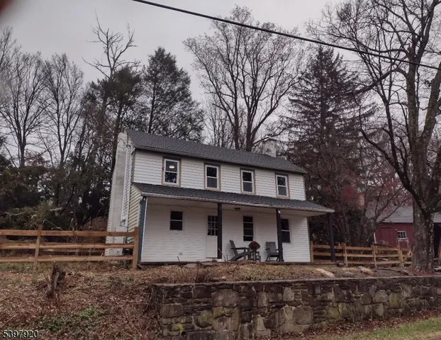 a front view of a house with trees