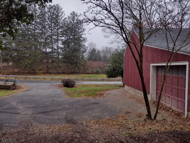a view of a yard with a tree