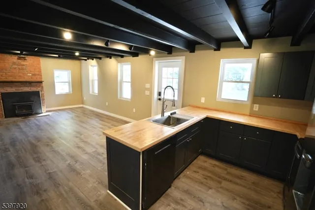 a kitchen with a sink stove and cabinets