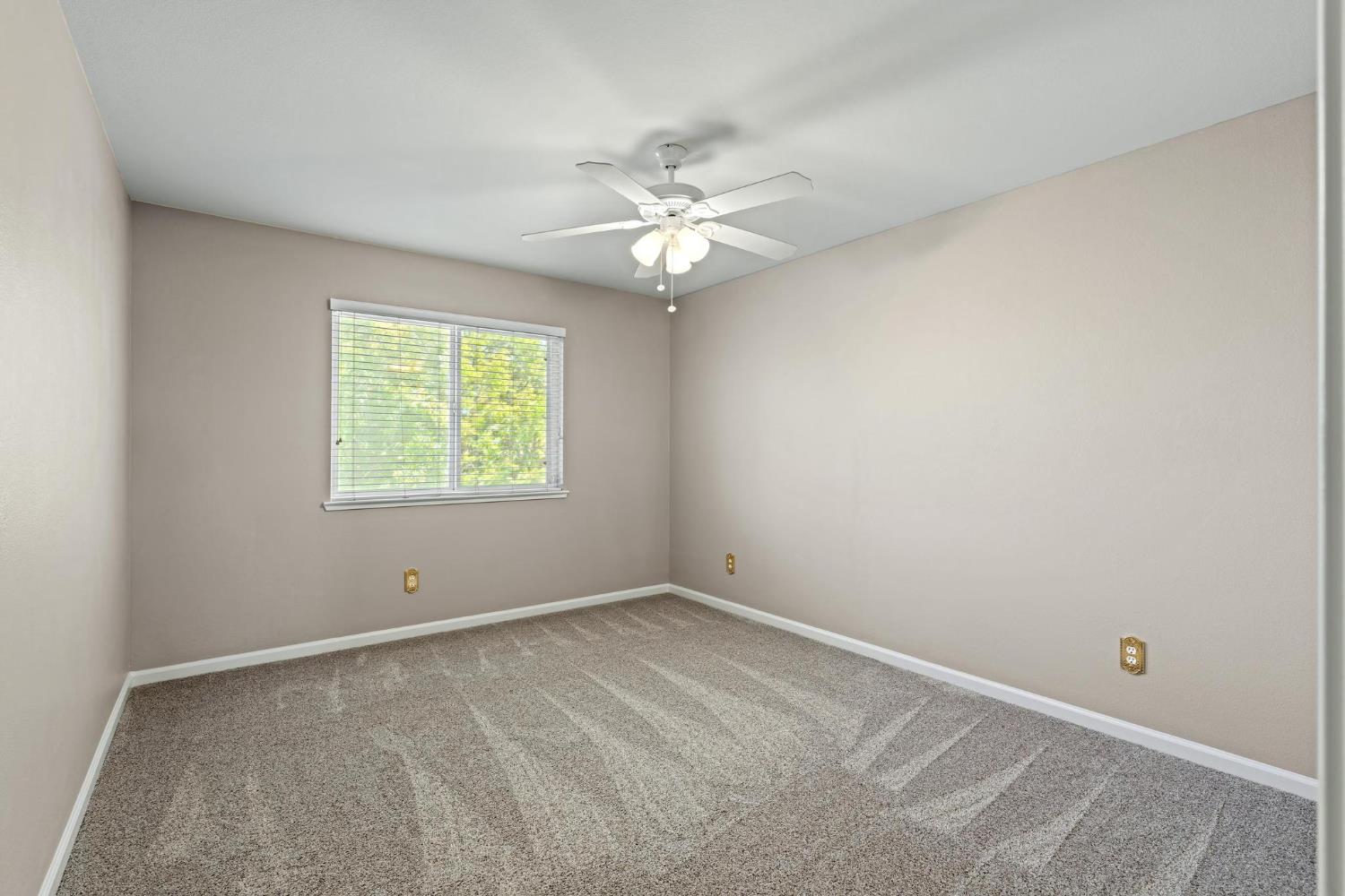 426 South Highland Avenue Ripon, CA 95366 - Photo 66 of 82 an empty room with a window and a fan