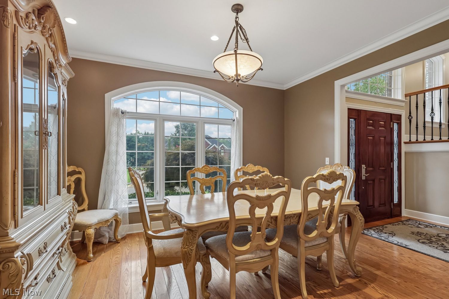 6836 Kyle Ridge Pointe Canfield, OH 44406 - Photo 15 of 45 formal dining room, recessed lighting, picture window with arched transom above it, Hardwood flooring