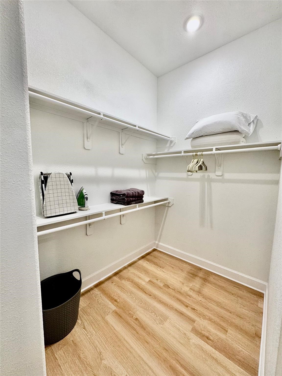 5306 Ridgeway Drive, Unit A Houston, TX 77033 - Photo 8 of 14 Walk-In Closet – Spacious walk-in closet offering generous hanging space and built-in shelving for convenient storage and organization.