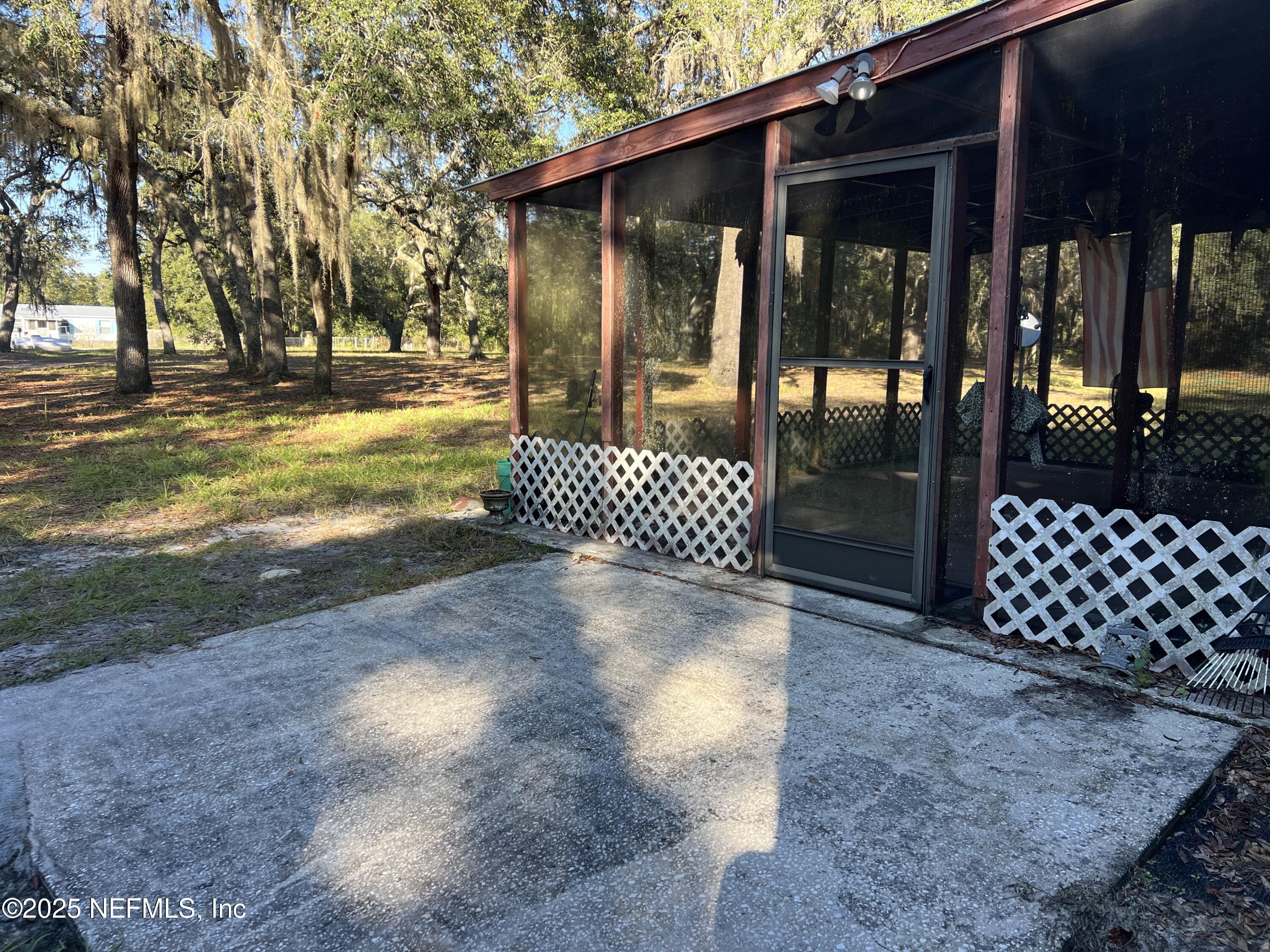 159 Keystone Road Palatka, FL 32177 - Photo 11 of 36 a view of a yard with wooden fence
