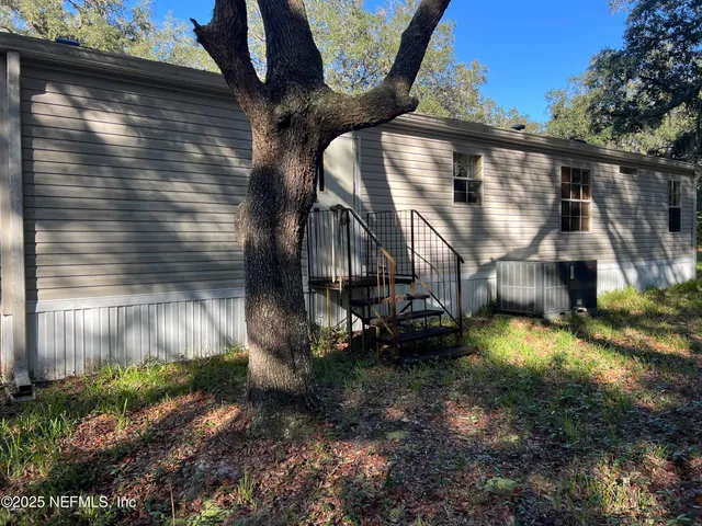 a view of a back yard of the house