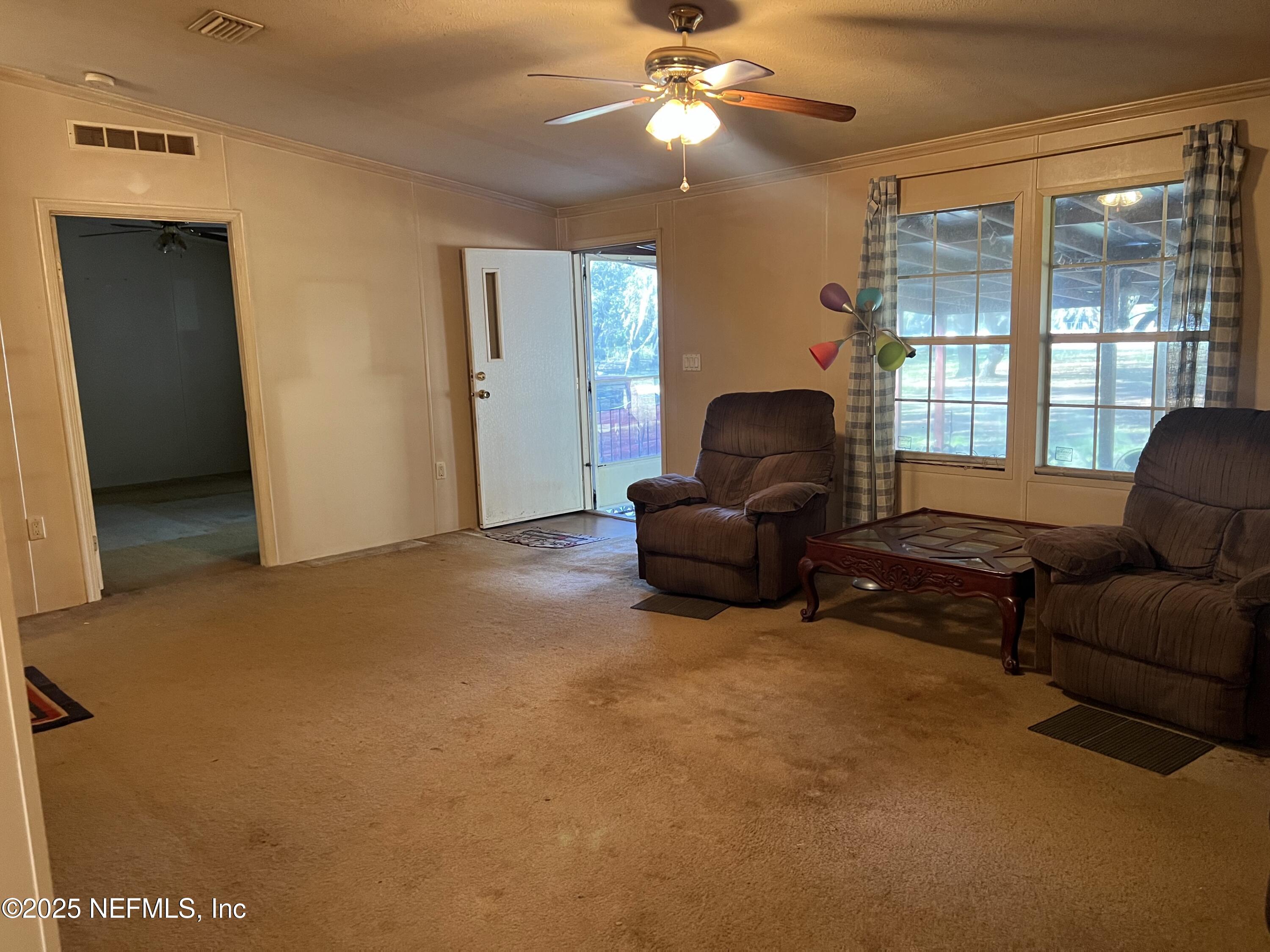 159 Keystone Road Palatka, FL 32177 - Photo 19 of 36 a living room with furniture and a large window